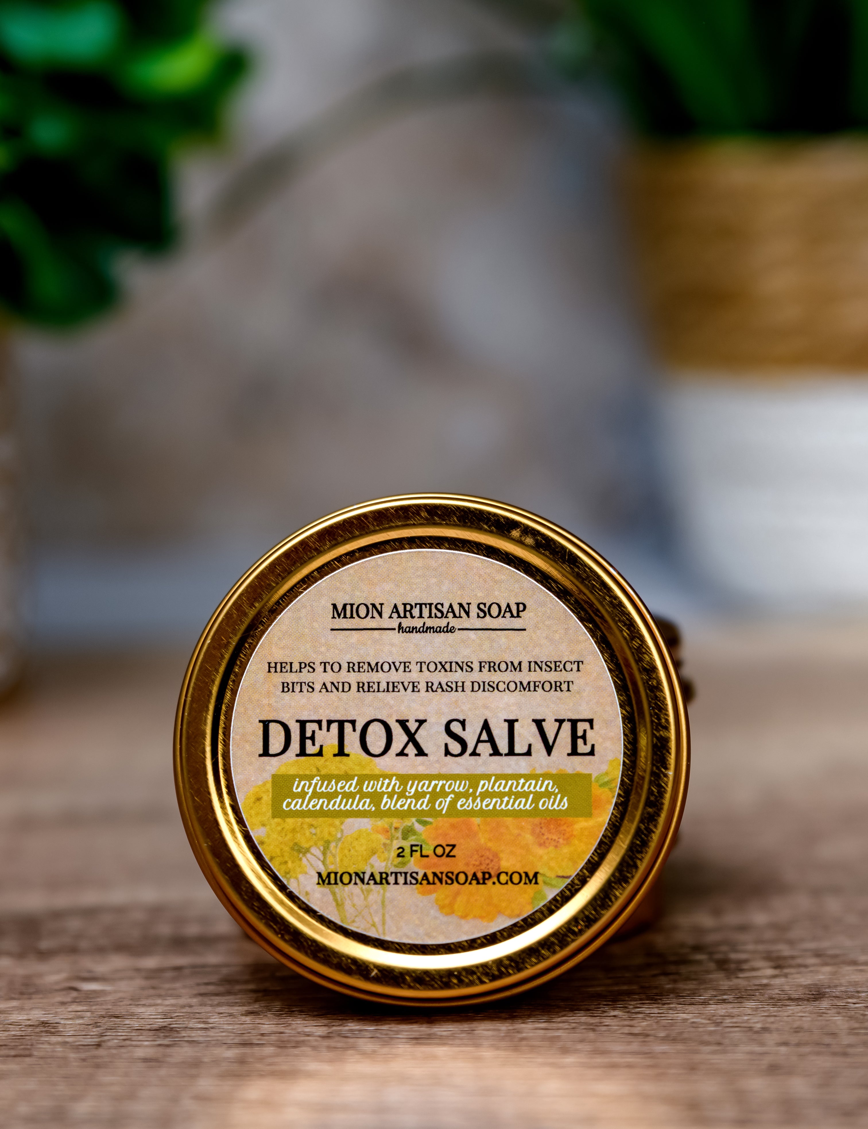 Detox salve container with label on a wooden surface