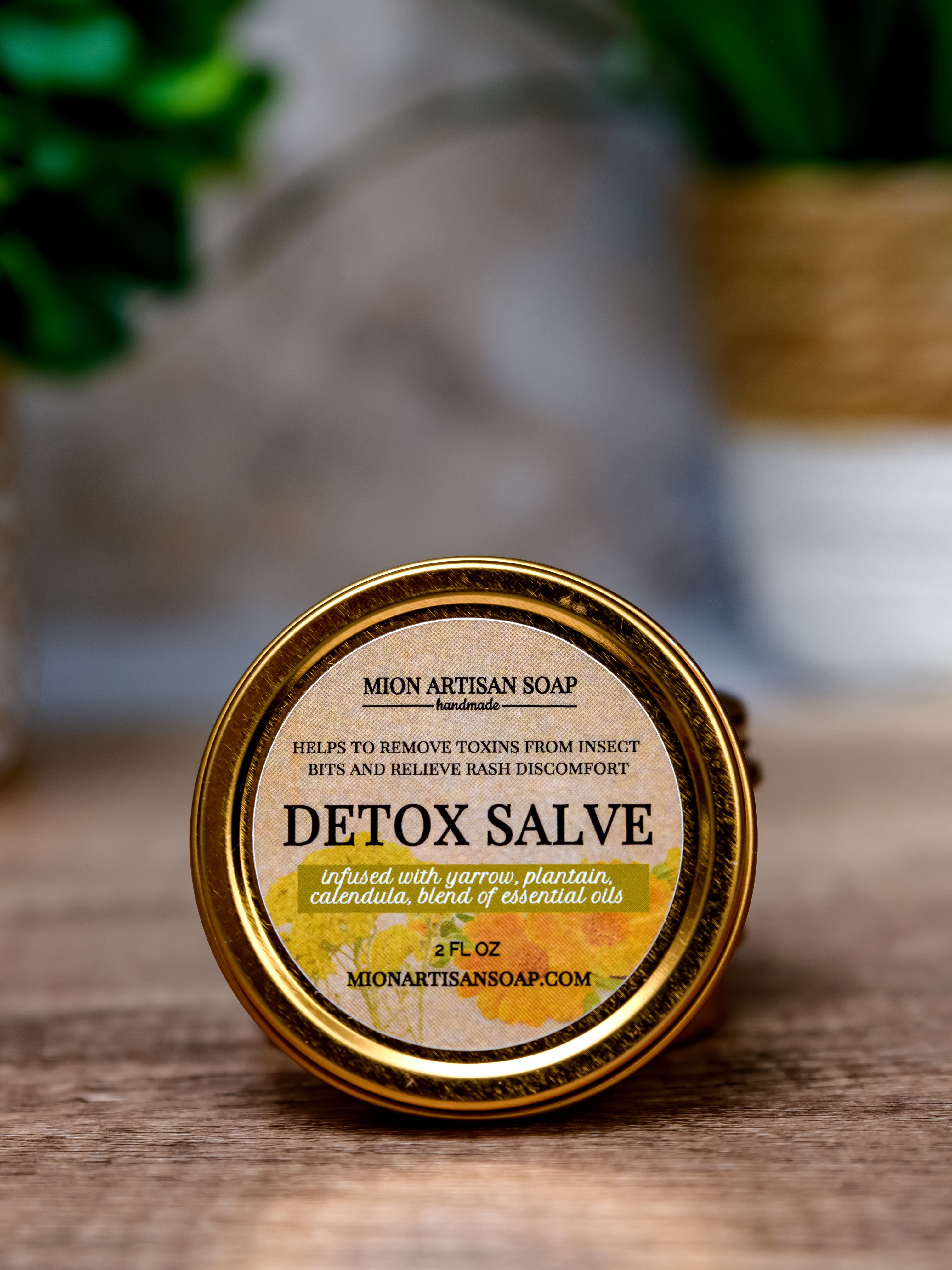 Detox salve container with label on a wooden surface